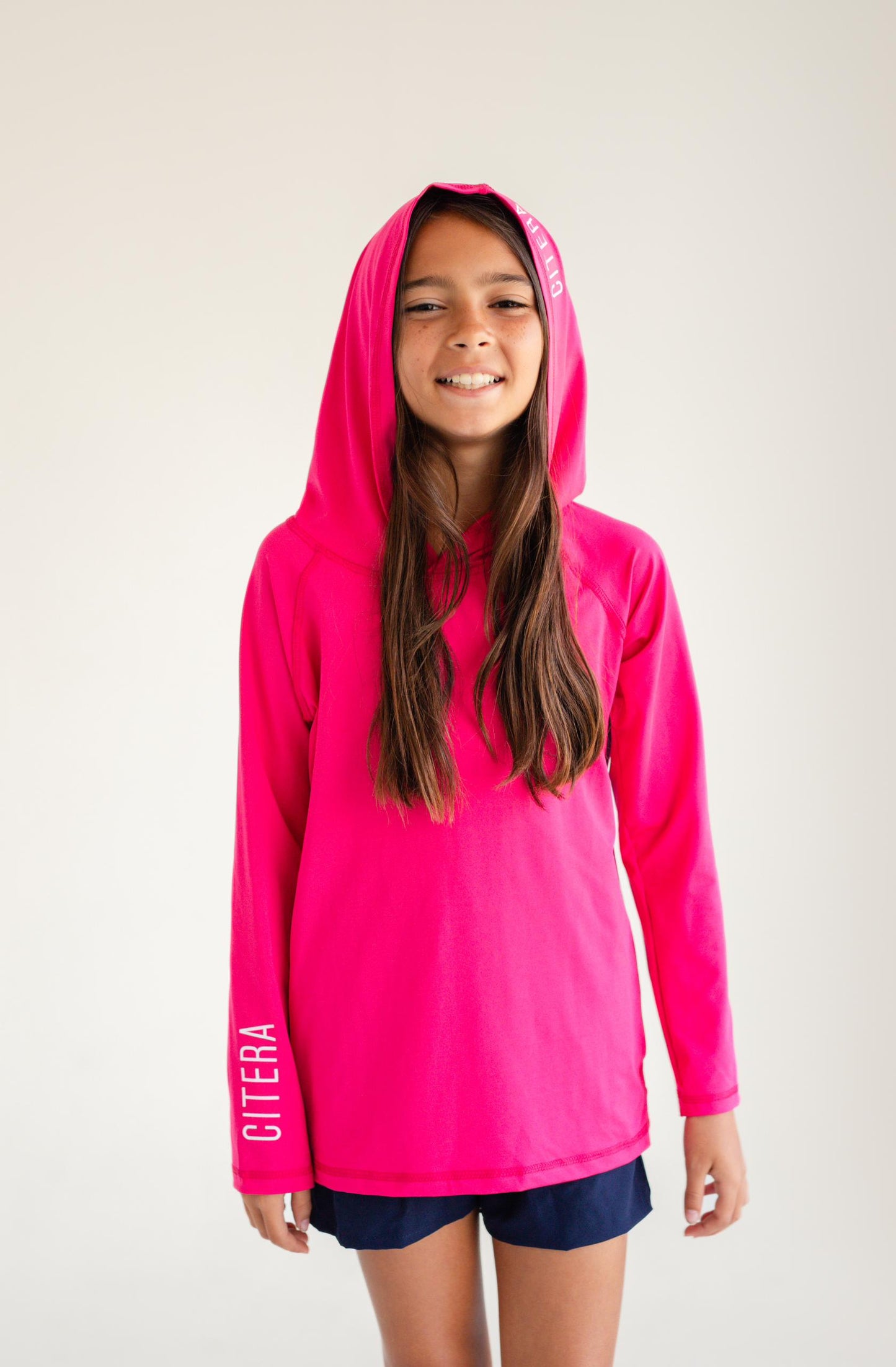 Franela UV Con Capucha Fucsia