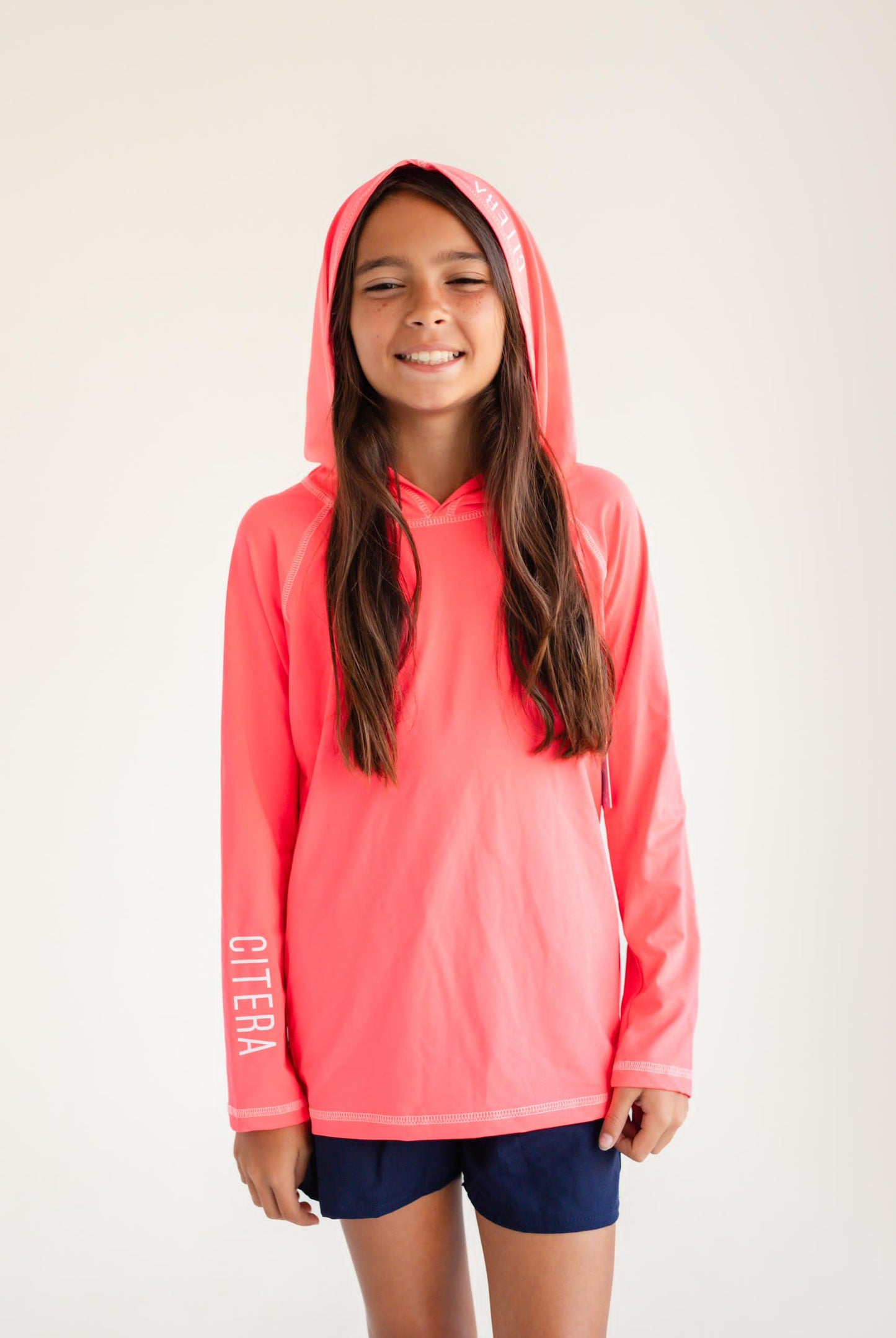 Franela UV Con Capucha Coral